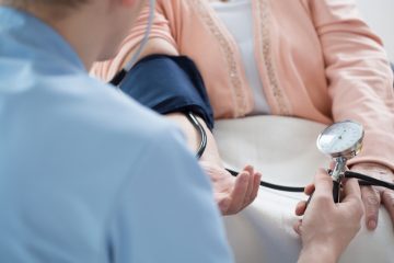 bigstock-Male-Nurse-Measuring-Blood-Pre-86664644